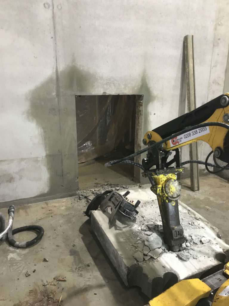 Brokk machine to pull out a reinforced concrete block